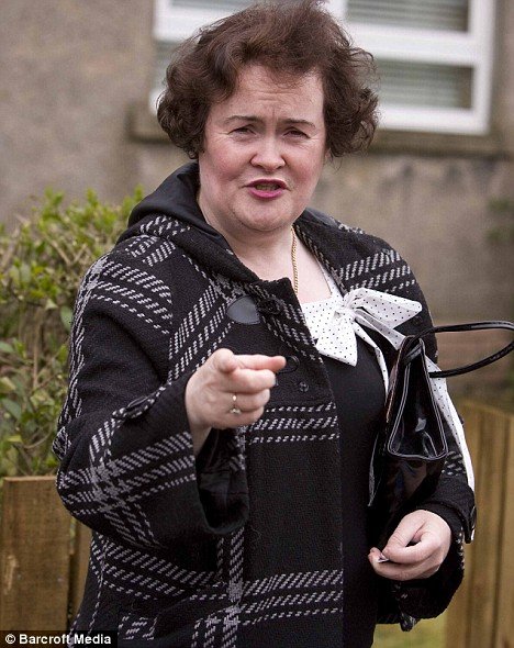 Putting on the war paint: Now Susan Boyle treats herself to a new lipstick
