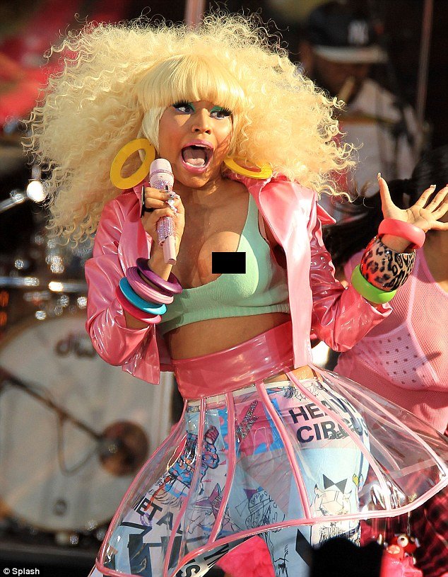 Wardrobe malfunction: Nicki Minaj falls out of her top on live TV