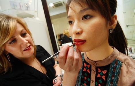 Times are tough, so women are shopping — for lipstick